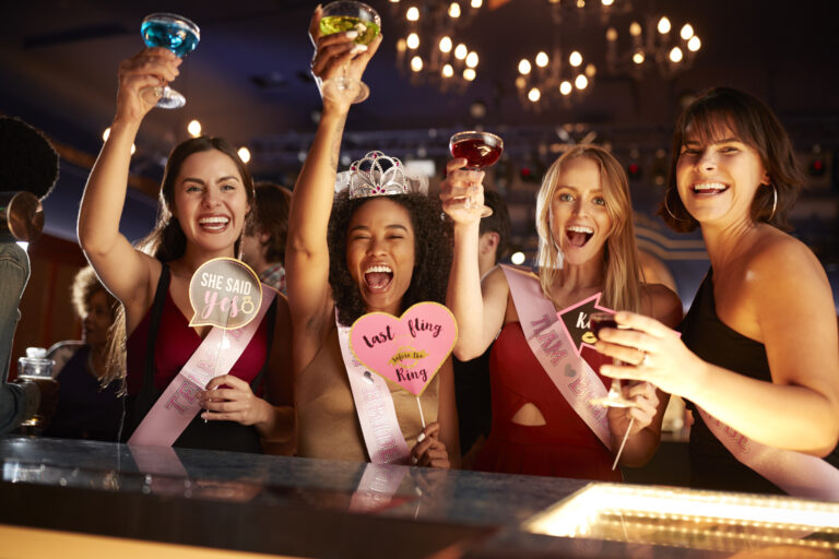 Group Of Female Friends Celebrating With Bride On Hen Party In Bar