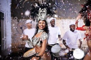Performing a live show. Shot of two female dancers with their band in the background